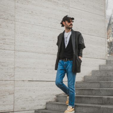 Man in Leather Jacket and Jeans Coming Down Stairs